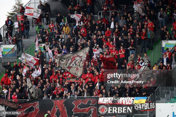 Bayer 04 Leverkusen fans present a Ukrainian flag to indicate peace and sympathy with Ukraine prior to the Bundesliga match between SpVgg Greuther...