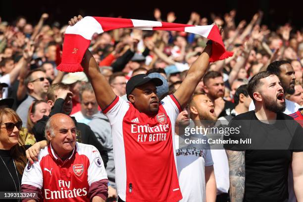 Arsenal fans show their support during the Premier League match between Arsenal and Manchester United at Emirates Stadium on April 23, 2022 in...