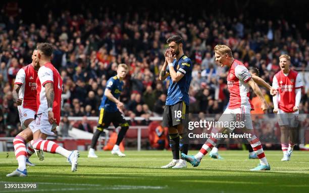 Bruno Fernandes of Manchester United reacts to a missed penalty during the Premier League match between Arsenal and Manchester United at Emirates...