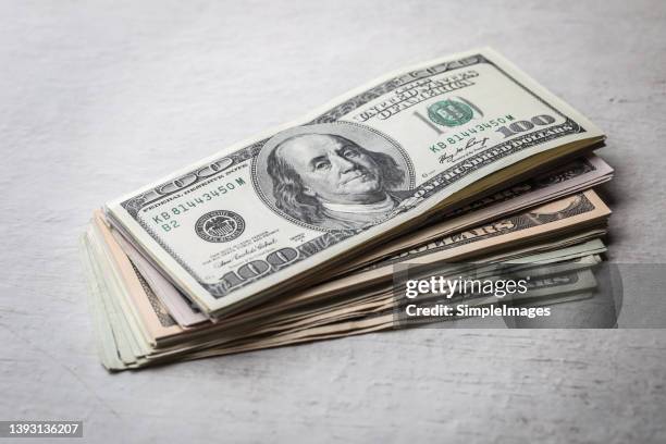folded hundred dollar bills - close up. - american one hundred dollar bill stockfoto's en -beelden