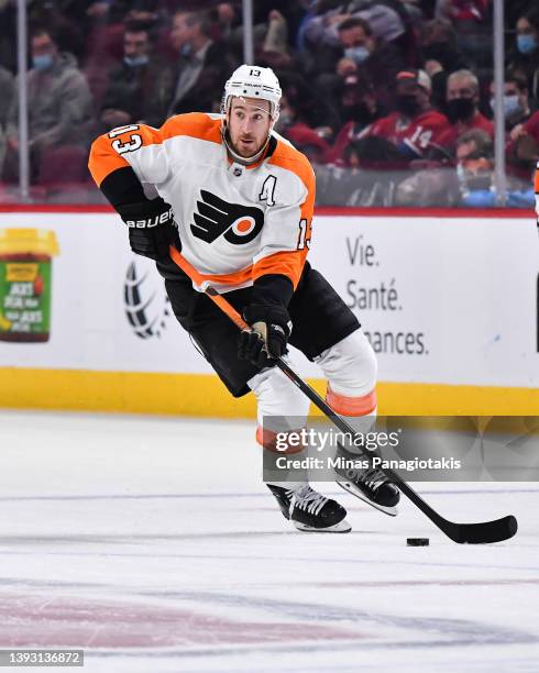 Kevin Hayes of the Philadelphia Flyers skates the puck against the Montreal Canadiens during the first period at Centre Bell on April 21, 2022 in...