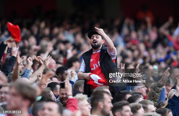 An Arsenal supporter gestures during the Premier League match between Arsenal and Manchester United at Emirates Stadium on April 23, 2022 in London,...