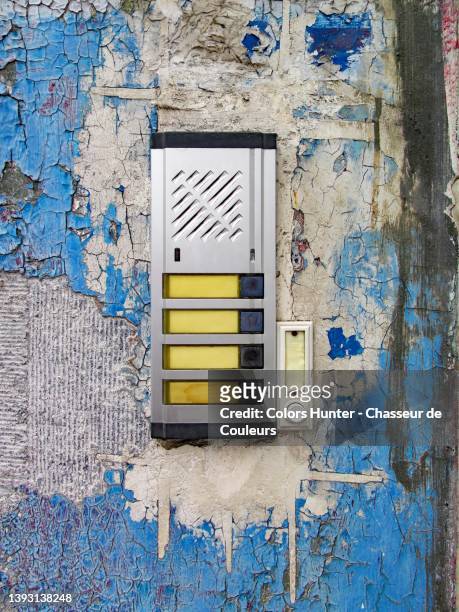 a vintage nameless intercom on a weathered wall in brussels - doorbell stock pictures, royalty-free photos & images