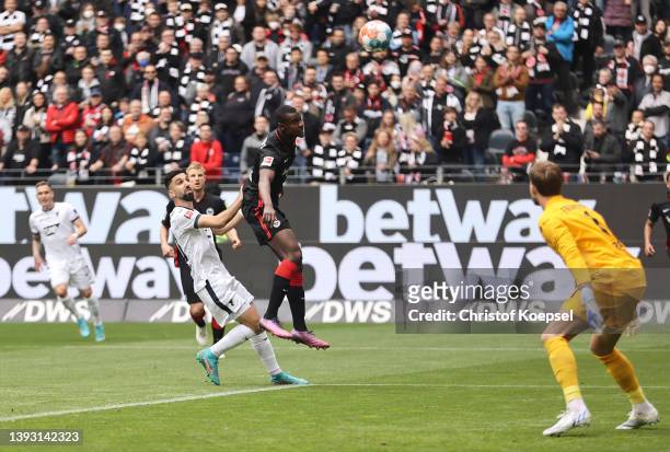 Evan Ndicka of Eintracht Frankfurt scores an own goal for TSG 1899 Hoffenheim's first goal during the Bundesliga match between Eintracht Frankfurt...