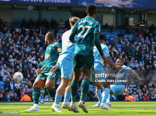 Gabriel Jesus of Manchester City scores their team's first goal during the Premier League match between Manchester City and Watford at Etihad Stadium...