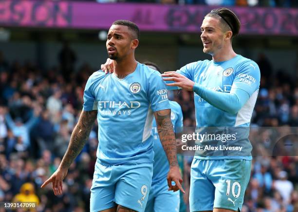 Gabriel Jesus celebrates with Jack Grealish of Manchester City after scoring their team's second goal during the Premier League match between...