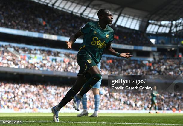 Hassane Kamara of Watford FC celebrates after scoring their team's first goal during the Premier League match between Manchester City and Watford at...