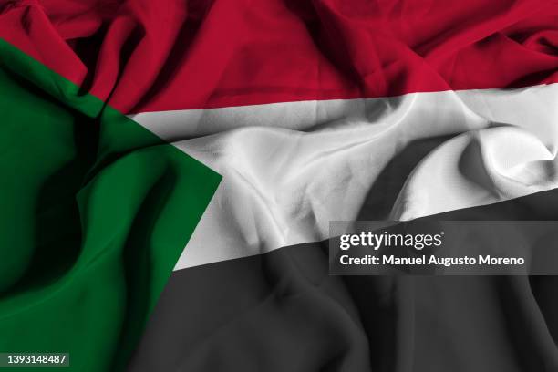 flag of sudan - clashes stock pictures, royalty-free photos & images