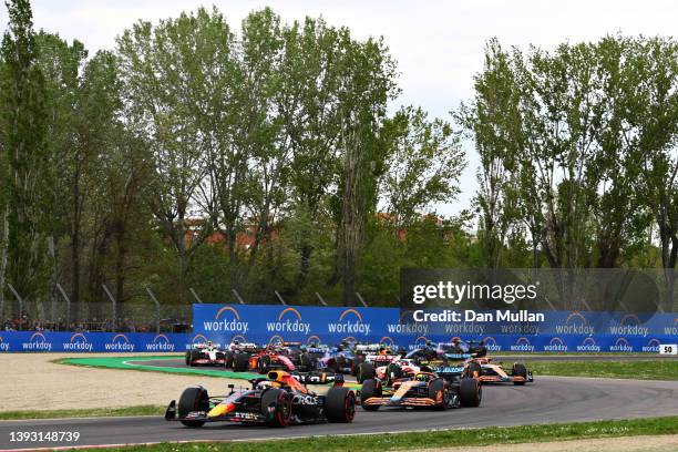 Max Verstappen of the Netherlands driving the Oracle Red Bull Racing RB18 leads Lando Norris of Great Britain driving the McLaren MCL36 Mercedes...