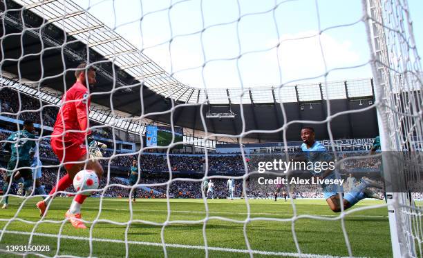 Gabriel Jesus of Manchester City scores their team's second goal past Ben Foster of Watford FC during the Premier League match between Manchester...