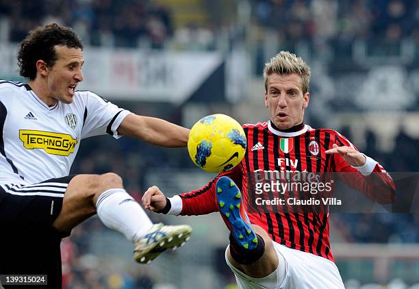 Maxi Lopez of AC Milan and Gianluca Comotto of AC Cesena compete for the ball during the Serie A match between AC Cesena and AC Milan at Dino Manuzzi...