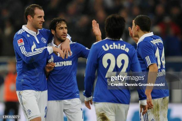 Christoph Metzelder of Schalke and teammates Raul Gonzalez, Atsuto Uchida and Kyriakos Papadopoulos celebrates after Klaas-Jan Huntelaar has scored...