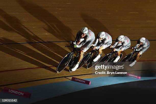 The Australia team of Jack Bobridge, Rohan Dennis, Alexander Edmondson and Michael Hepburn ride on their way to victory in the Men's Team Pursuit...