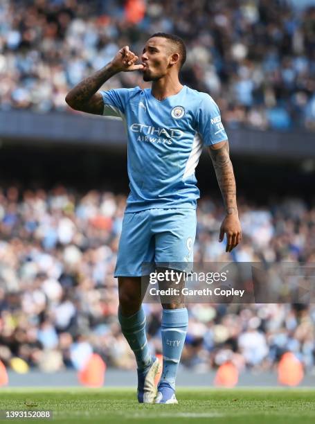 Gabriel Jesus of Manchester City celebrates after scoring their side's fourth goal from a penalty during the Premier League match between Manchester...