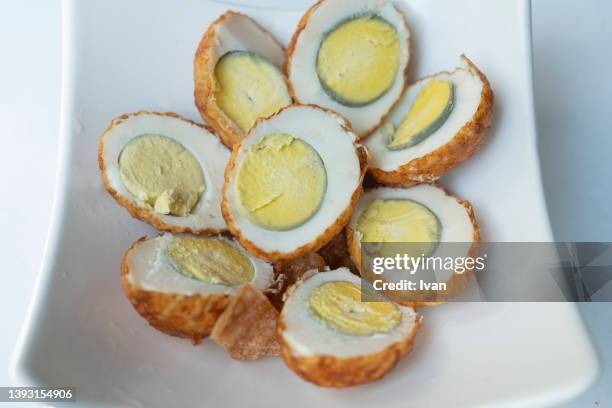 deep fried egg  in white plate - center back stock-fotos und bilder