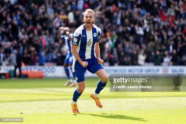 Jack Whatmough of Wigan Athletic celebrates after scoring their side's first goal during the Sky Bet League One match between Wigan Athletic and...