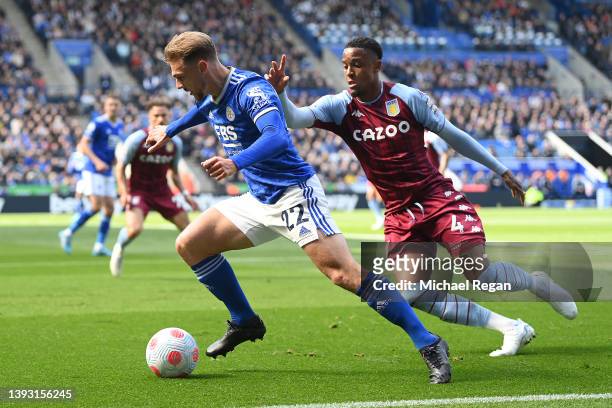 Kiernan Dewsbury-Hall of Leicester City is challenged by Ezri Konsa of Aston Villa during the Premier League match between Leicester City and Aston...