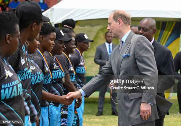 Prince Edward, Earl of Wessex presents medals to T10 Cricket team the Balliceaux Warriors at Arnos Vale Playing Field on April 23, 2022 in Arnos...