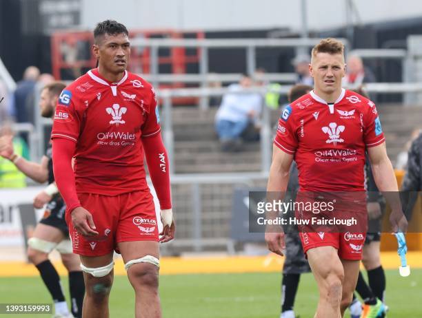 Sam Lousi with Jonathan Davies of the Scarlets after the United Rugby Championship match between Dragons and Scarlets at Rodney Parade on April 23,...