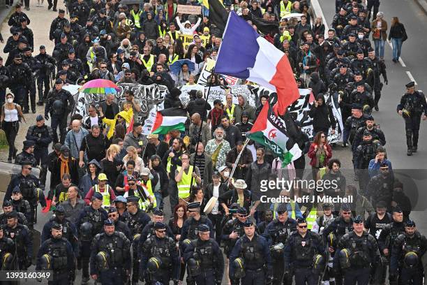 Gilet Jaune demonstrators protest as they make their way from Place d Italia to Place de Nation on April 23, 2022 in Paris, France. Emmanuel Macron...