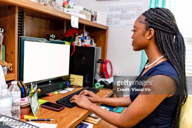 aboriginal teacher on computer - administrative professional day stock pictures, royalty-free photos & images