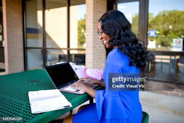 aboriginal teacher using device outside 4 - administrative professionals day stockfoto's en -beelden