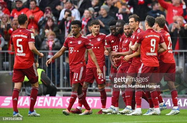 Serge Gnabry of FC Bayern Muenchen celebrates with teammates after scoring their team's first goal during the Bundesliga match between FC Bayern...