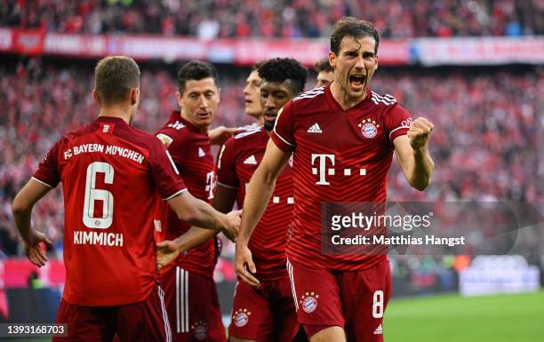 Leon Goretzka celebrates after teammate Robert Lewandowski of FC Bayern Muenchen scored their sides second goal during the Bundesliga match between...
