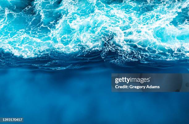 waves in the caribbean sea - boat wake stock pictures, royalty-free photos & images