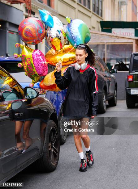 Bella Hadid go shopping for balloons for her sister Gigi Hadid at the Ballooon Saloon on April 23, 2022 in New York City.
