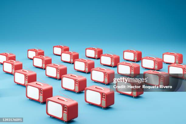 computer generated of many television of red color with glowing screen on blue background, 3d render - three dimensional tv stock pictures, royalty-free photos & images