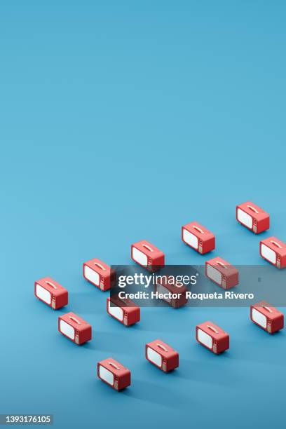 computer generated of many television of red color with glowing screen on blue background, 3d render - retro television stock pictures, royalty-free photos & images
