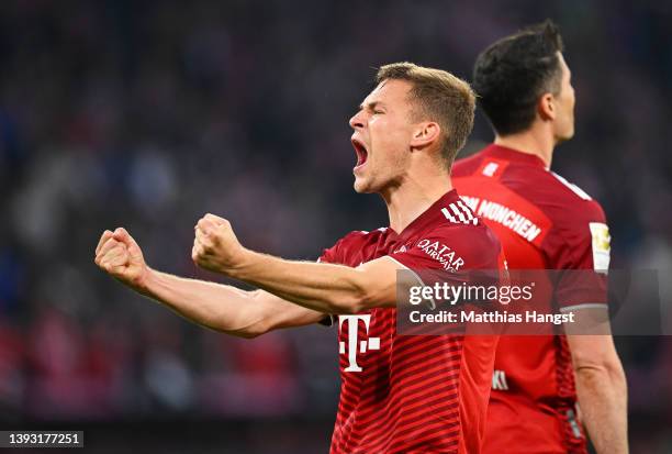 Joshua Kimmich of FC Bayern Muenchen celebrates after their sides third goal during the Bundesliga match between FC Bayern Muenchen and Borussia...