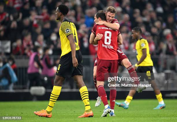 Leon Goretzka and Joshua Kimmich of FC Bayern Muenchen celebrate after their sides victory, which results in FC Bayern Muenchen becoming Bundesliga...