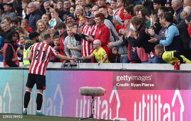 Christian Eriksen of Brentford acknowledges the fans after their sides draw during the Premier League match between Brentford and Tottenham Hotspur...