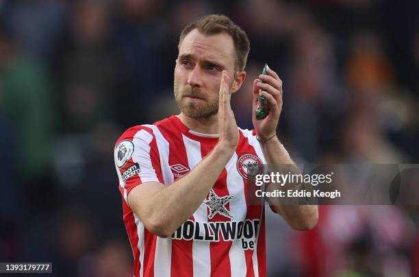 Christian Eriksen of Brentford applauds the fans after their sides draw during the Premier League match between Brentford and Tottenham Hotspur at...