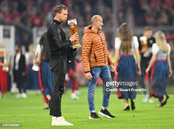 Julian Nagelsmann, Head Coach of FC Bayern Muenchen drinks beer after their sides victory, which results in FC Bayern Muenchen becoming Bundeliga...