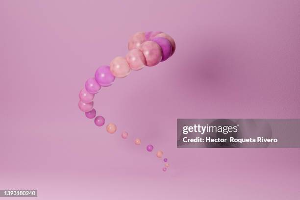 endless spiral of white and pastel tones balls onpink background - hair coils stockfoto's en -beelden