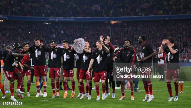Bayern Muenchen players celebrate with the fans after their sides victory won them the Bundesliga title during the Bundesliga match between FC Bayern...