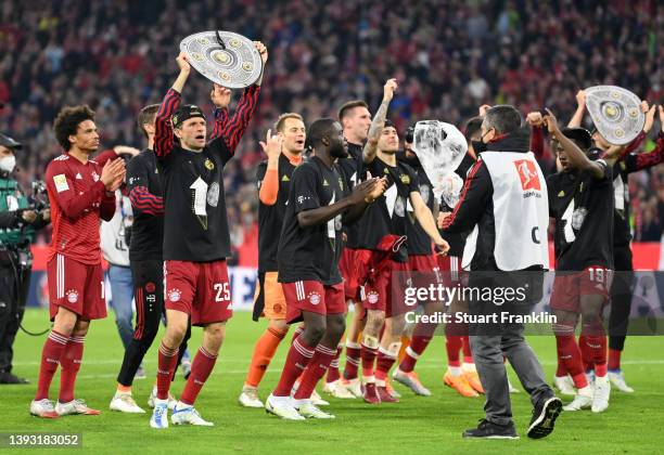 Thomas Mueller of FC Bayern Muenchen celebrates after their sides victory which wins FC Bayern Muenchen the Bundesliga title during the Bundesliga...