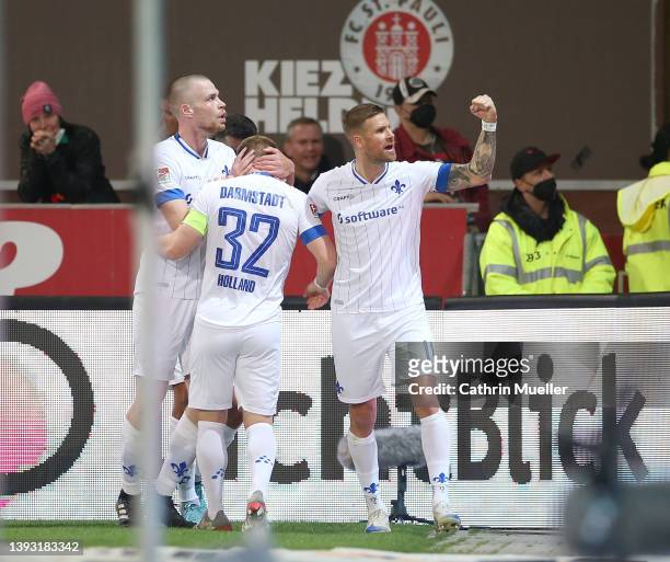 Fabian Holland of SV Darmstadt 98 and his teammates of SV Darmstadt 98 celebrate after scoring their sides second goal during the Second Bundesliga...