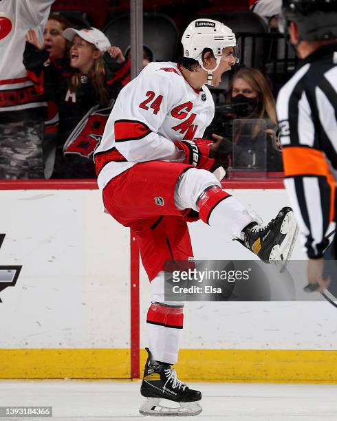 Seth Jarvis of the Carolina Hurricanes celebrates the game winning goal during the overtime period against the New Jersey Devils at Prudential Center...