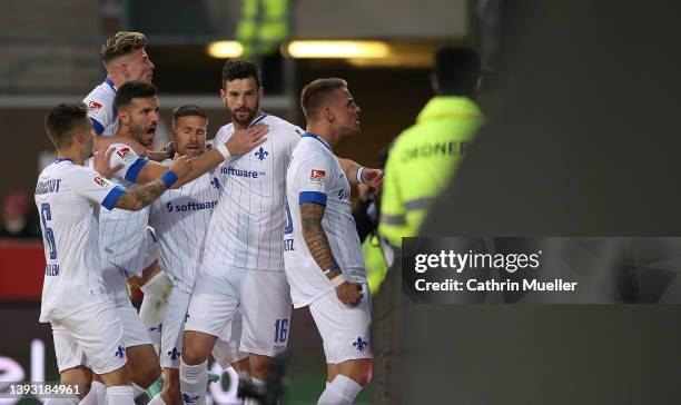 Luca Pfeiffer and his teammates of SV Darmstadt 98 celebrate after scoring their sides first goal during the Second Bundesliga match between FC St....