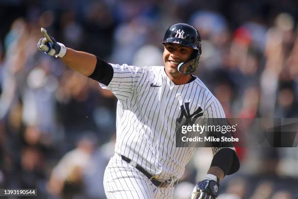 Gleyber Torres of the New York Yankees celebrates his walk-off RBI single in the bottom of the ninth inning to defeat the Cleveland Guardians 5-4 at...