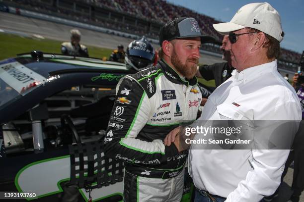 Jeffrey Earnhardt, driver of the ForeverLawn Chevrolet, and team owner Richard Childress shake hands on the grid prior to the NASCAR Xfinity Series...