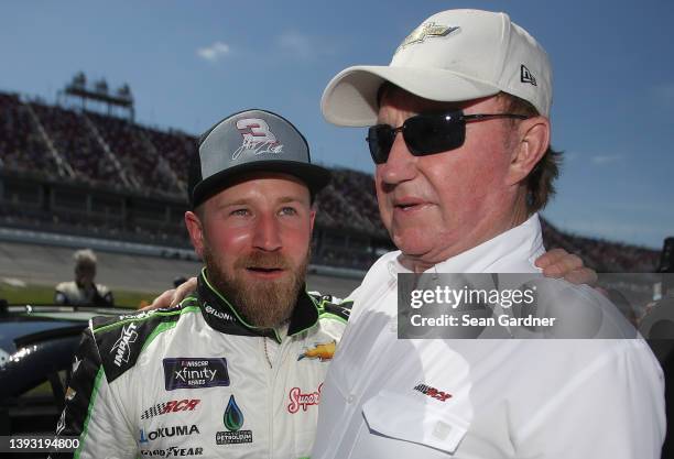 Jeffrey Earnhardt, driver of the ForeverLawn Chevrolet, and team owner Richard Childress embrace on the grid prior to the NASCAR Xfinity Series...