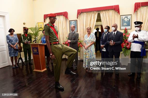 Prince Edward, Earl of Wessex and Sophie, Countess of Wessex present a Duke Of Edinburgh Gold award to a recent recipient at Government House on...