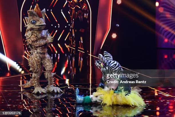 Das Zebra" celebrates winning next to "Der Dornteufel" during the finals of the 6th season of "The Masked Singer" at MMC Studios on April 23, 2022 in...