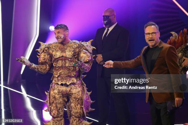 Mark Keller is revealed to be "Der Dornteufel" during the finals of the 6th season of "The Masked Singer" at MMC Studios on April 23, 2022 in...