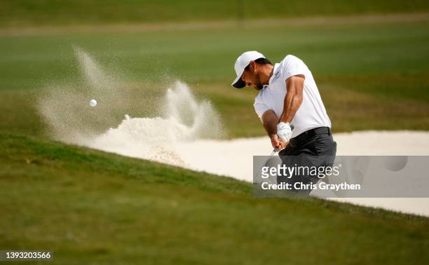 Jason Day of Australia plays a shot from a bunker on the 13th hole during the third round of the Zurich Classic of New Orleans at TPC Louisiana on...